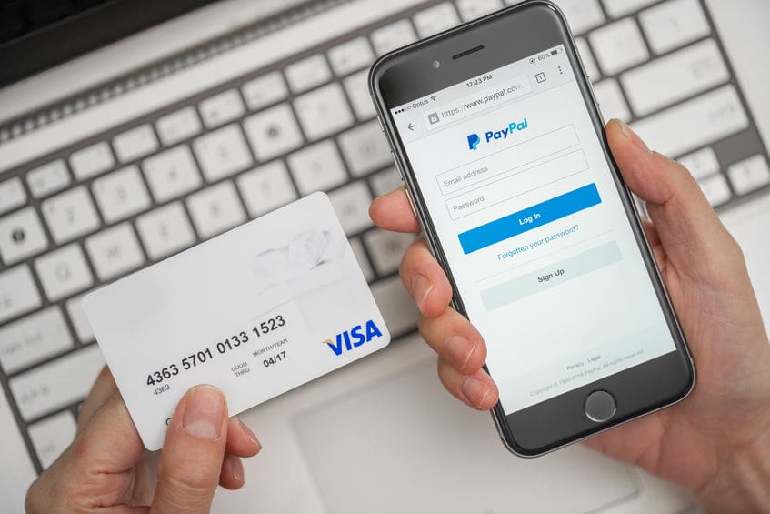 Melbourne, Australia - May 10, 2016: Using PayPal and credit card for online shopping. PayPal is a worldwide online payment system and one of the most popular ways of making payment on the Internet.